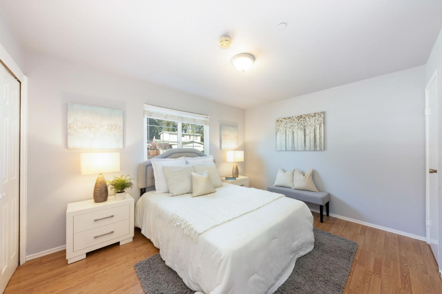 1168 Crespi Drive Pacifica, CA 94044 - Photo 21 of 42 a bed room with a bed and a lamp