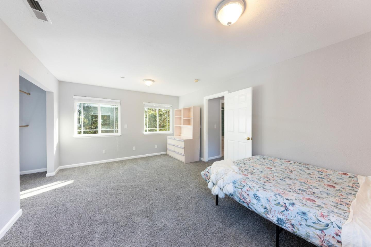 1168 Crespi Drive Pacifica, CA 94044 - Photo 28 of 42 a bedroom with a bed and a window