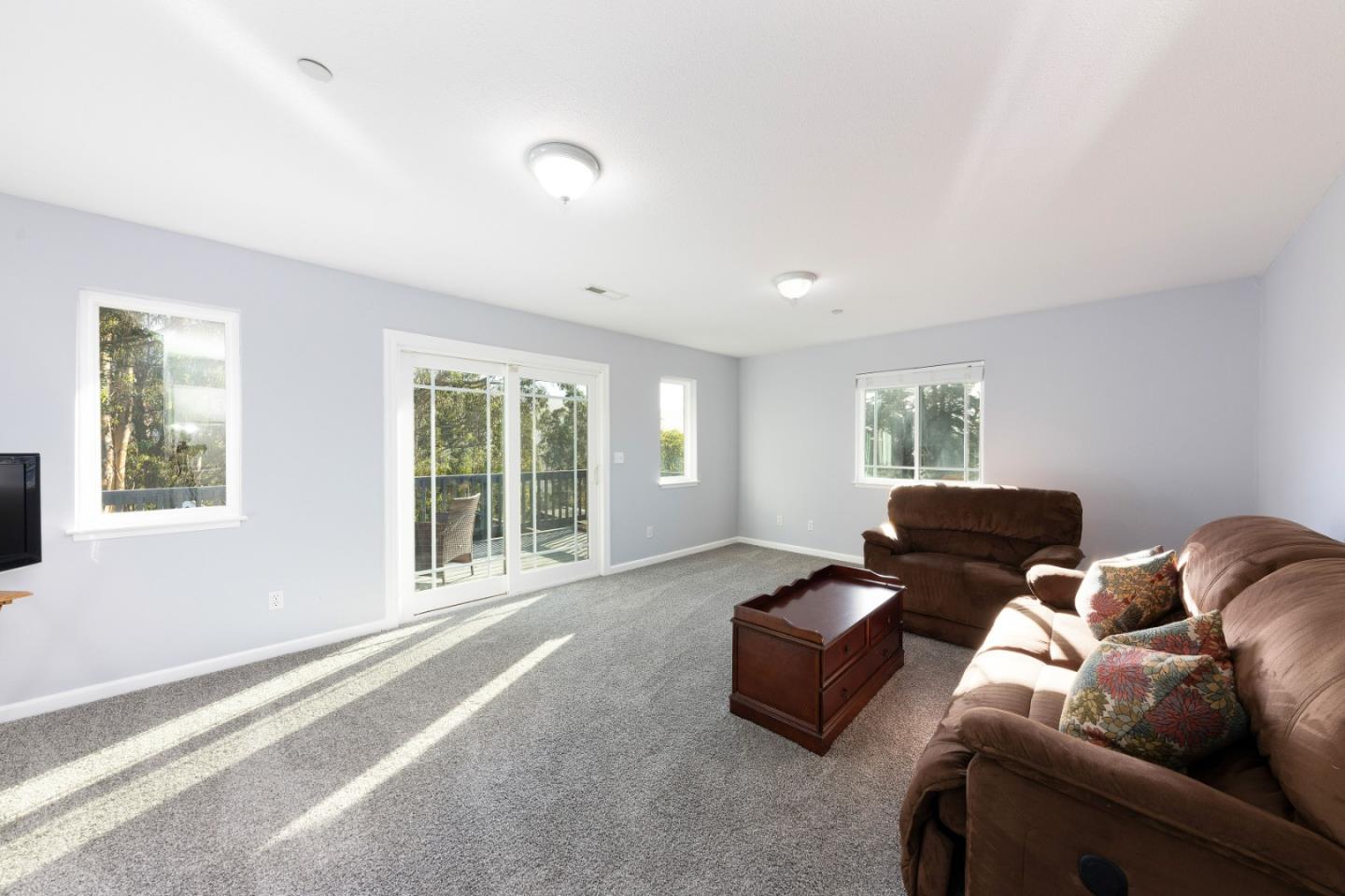 1168 Crespi Drive Pacifica, CA 94044 - Photo 29 of 42 a living room with furniture and a flat screen tv