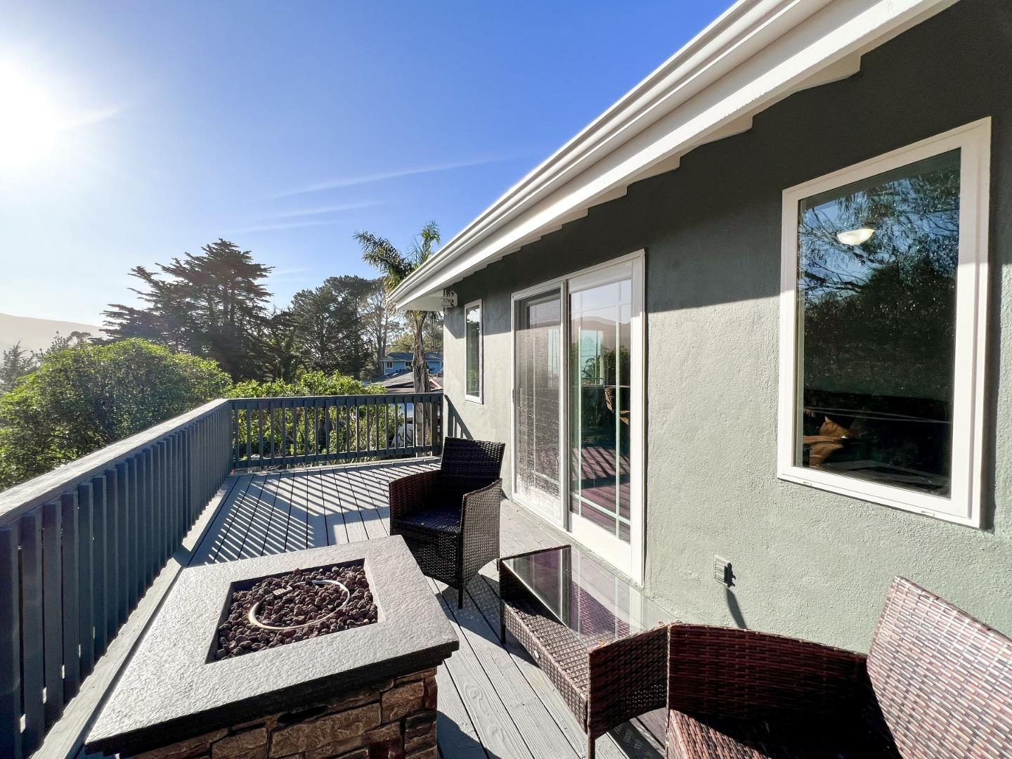 1168 Crespi Drive Pacifica, CA 94044 - Photo 30 of 42 a balcony with wooden floor and outdoor seating