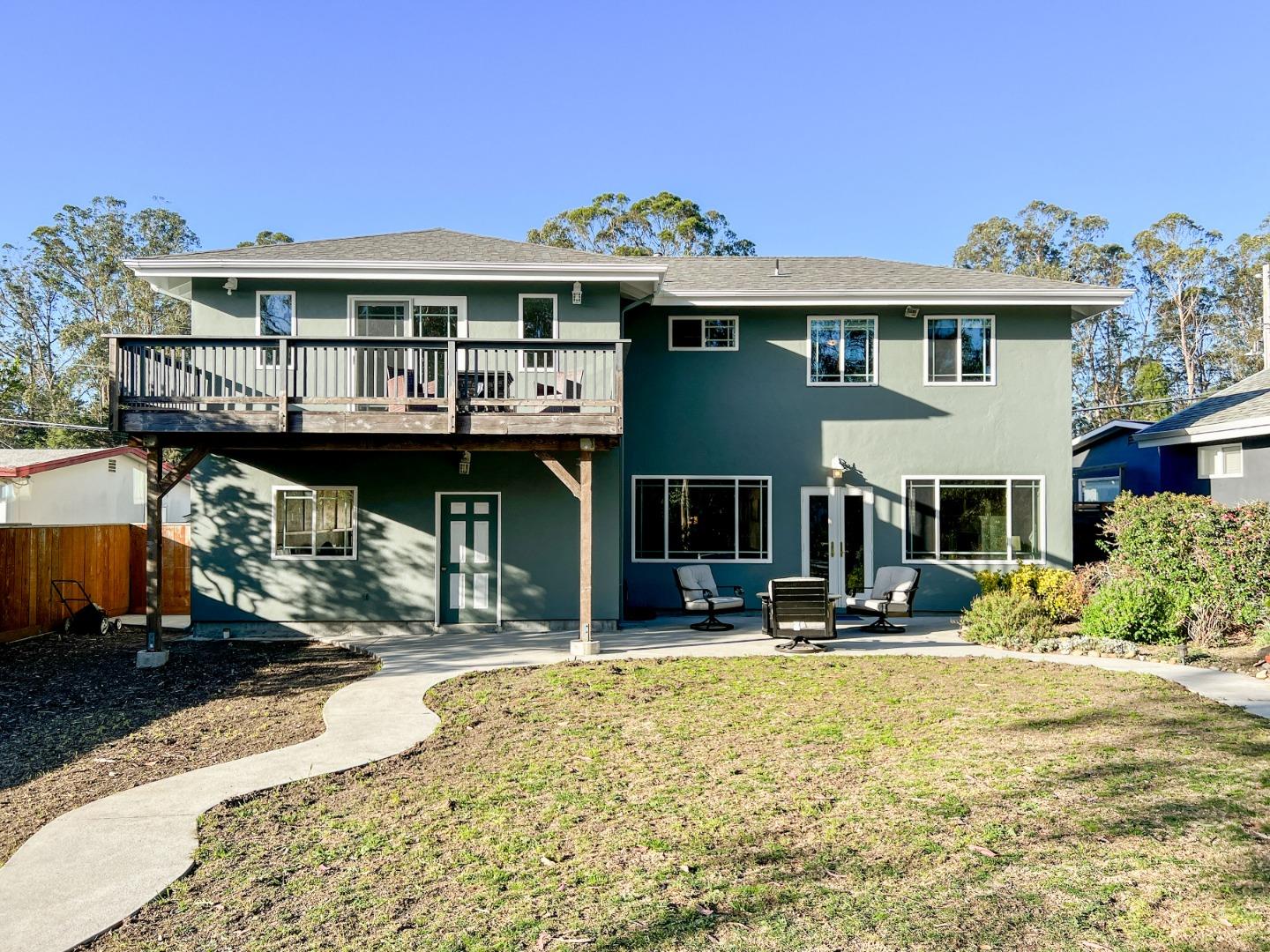 1168 Crespi Drive Pacifica, CA 94044 - Photo 37 of 42 a view of a white house with large windows