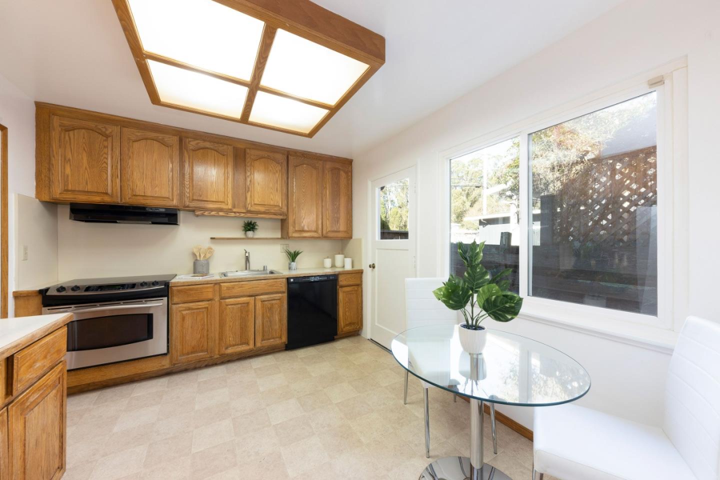 1168 Crespi Drive Pacifica, CA 94044 - Photo 10 of 42 a kitchen with stainless steel appliances granite countertop a sink stove and cabinets