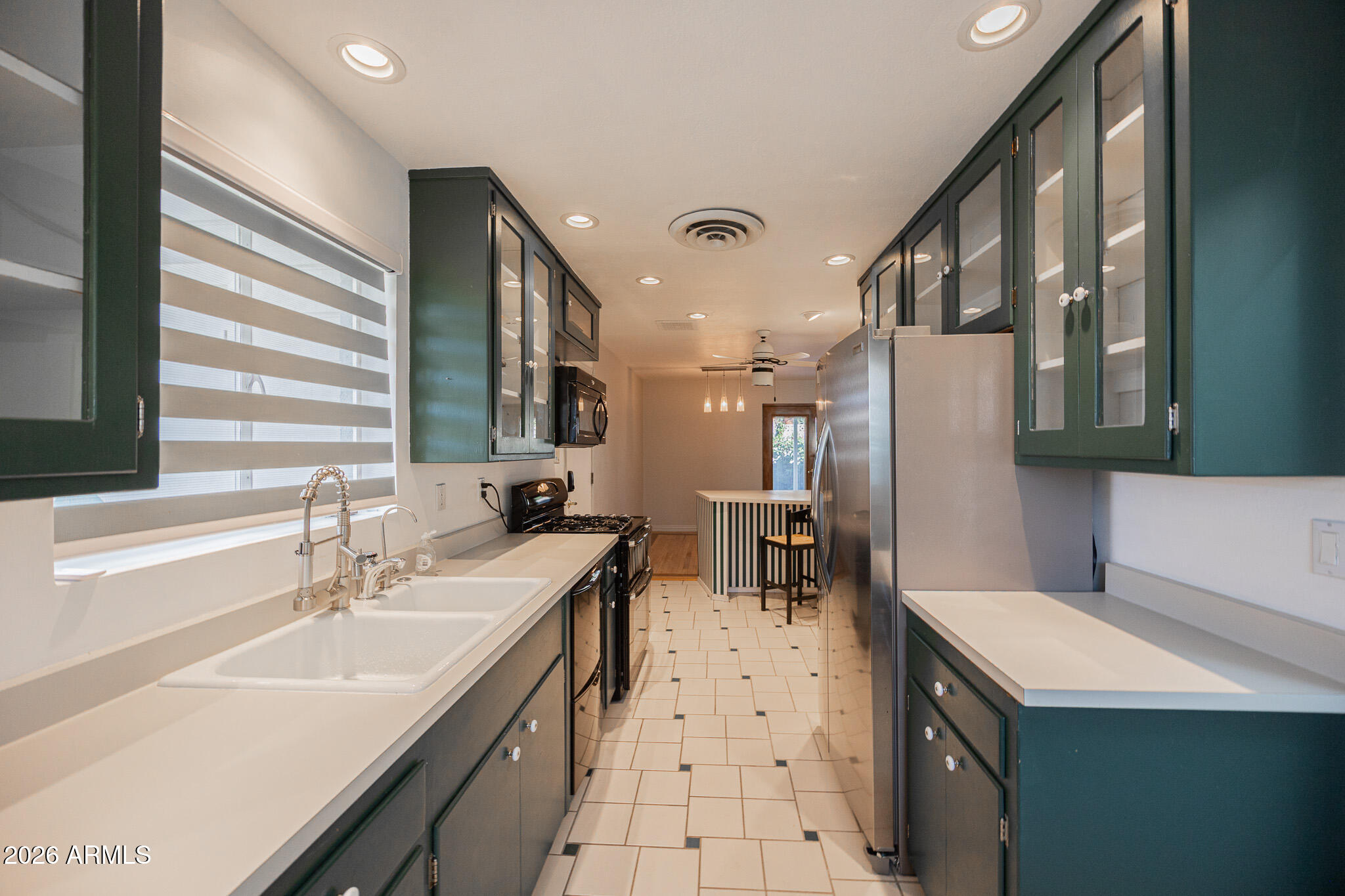 3137 North 4th Avenue Phoenix, AZ 85013 - Photo 13 of 36 a kitchen with a sink appliances and cabinets