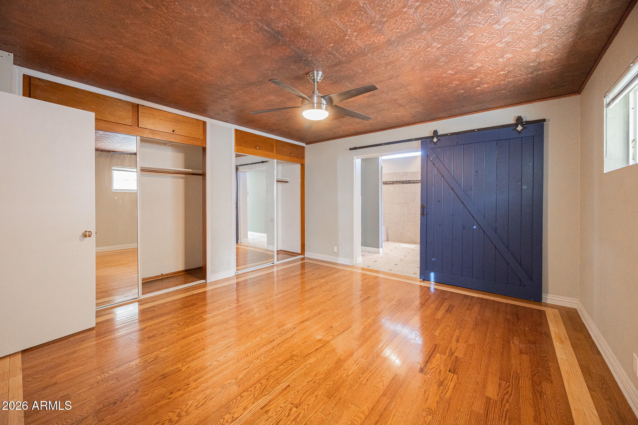 3137 North 4th Avenue Phoenix, AZ 85013 - Photo 14 of 36 a view of an empty room with wooden floor