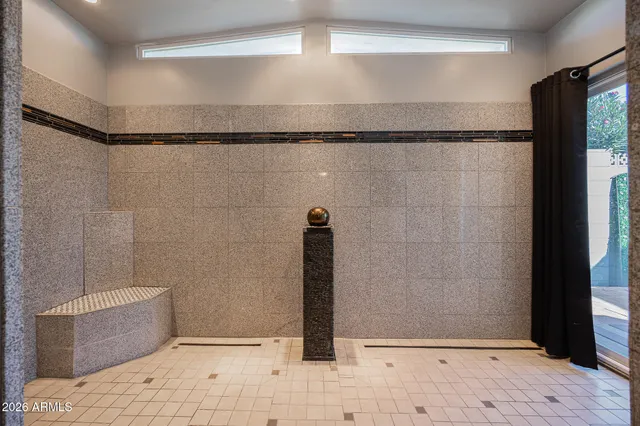 a bathroom with a sink and shower