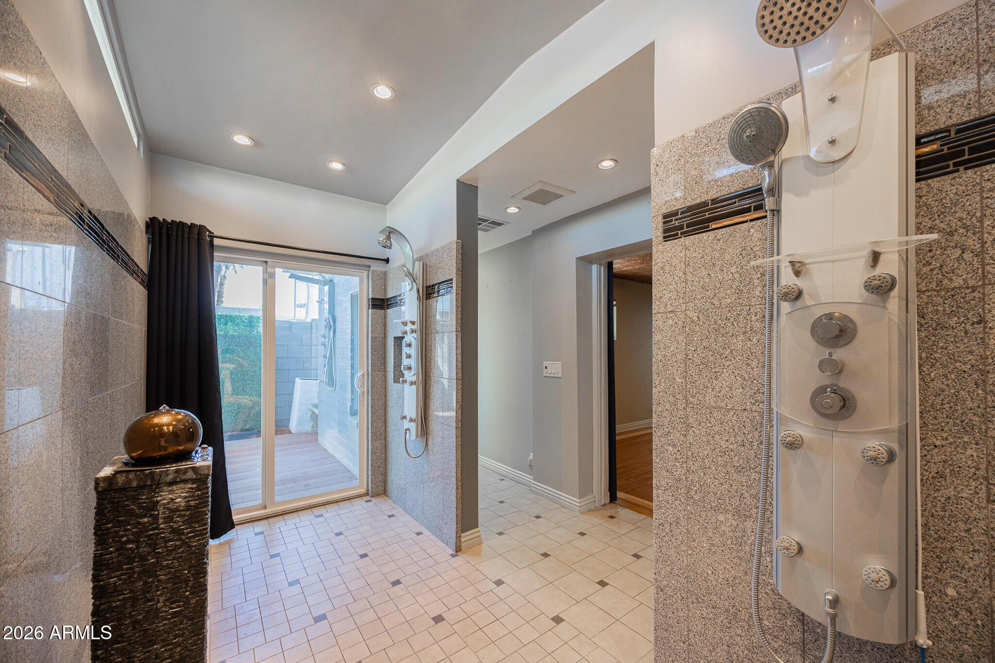3137 North 4th Avenue Phoenix, AZ 85013 - Photo 19 of 36 a bathroom with a glass door shower and a sink