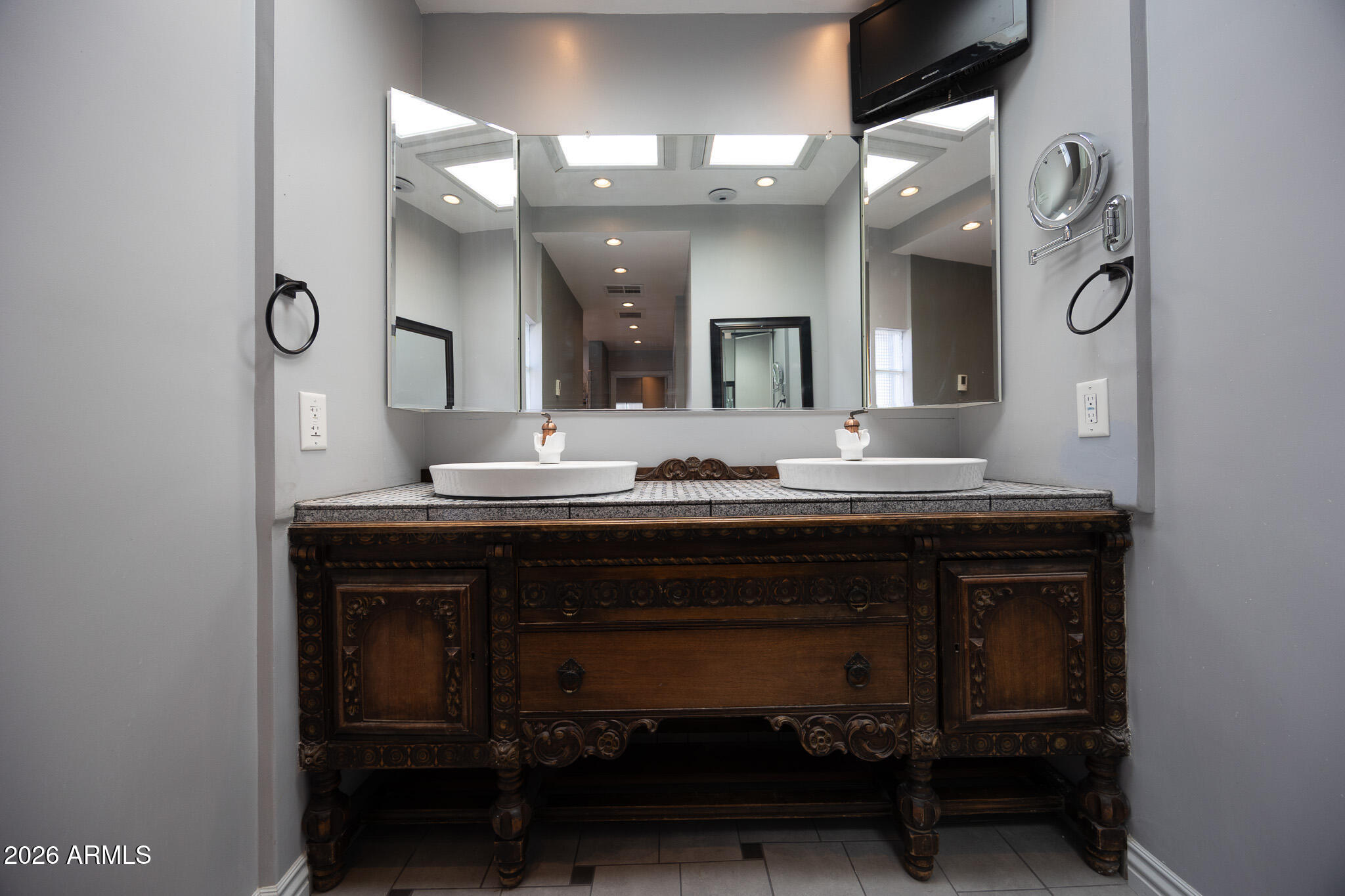 3137 North 4th Avenue Phoenix, AZ 85013 - Photo 20 of 36 a bathroom with a sink and a mirror
