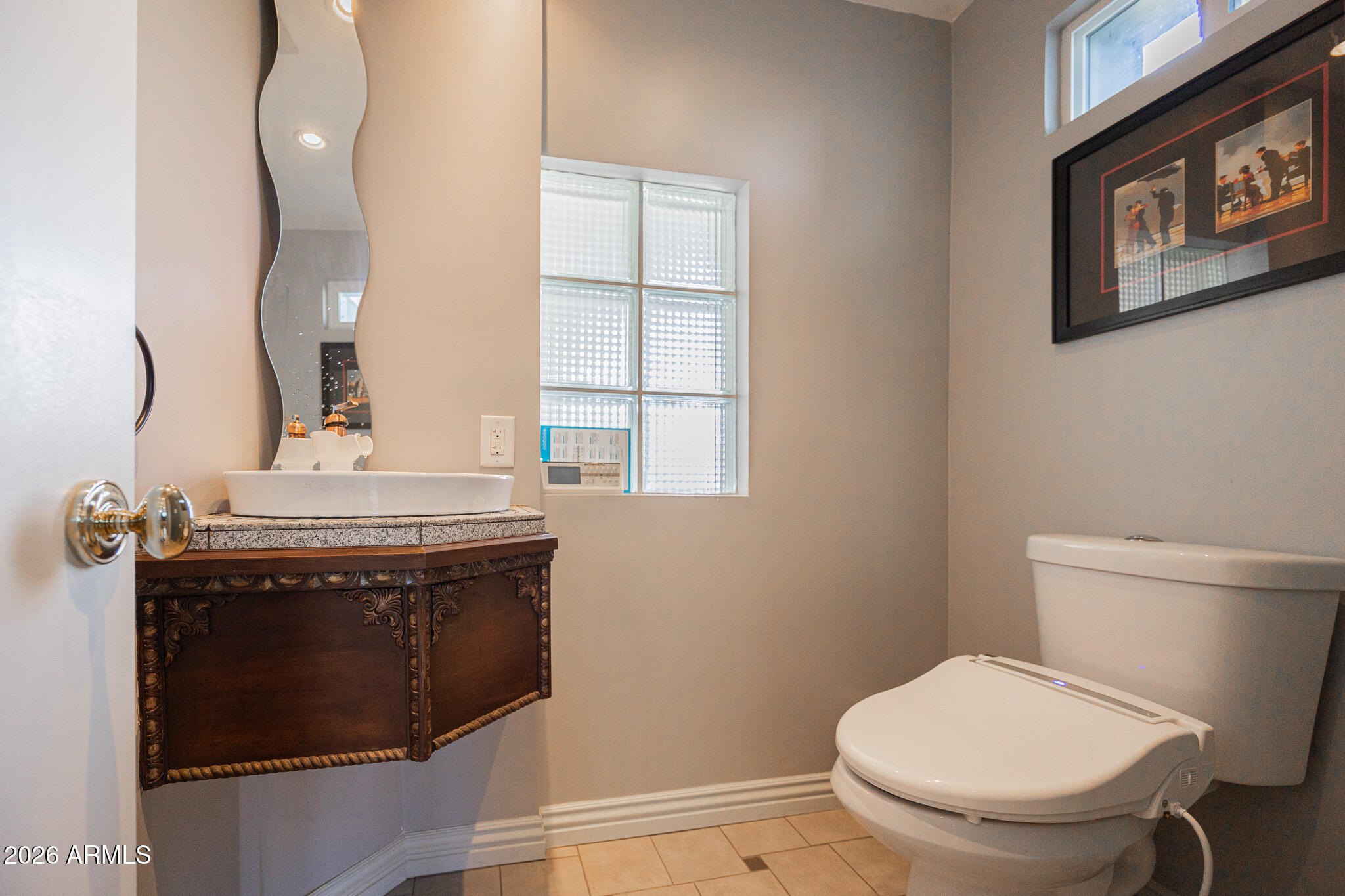 3137 North 4th Avenue Phoenix, AZ 85013 - Photo 21 of 36 a bathroom with a toilet and a sink
