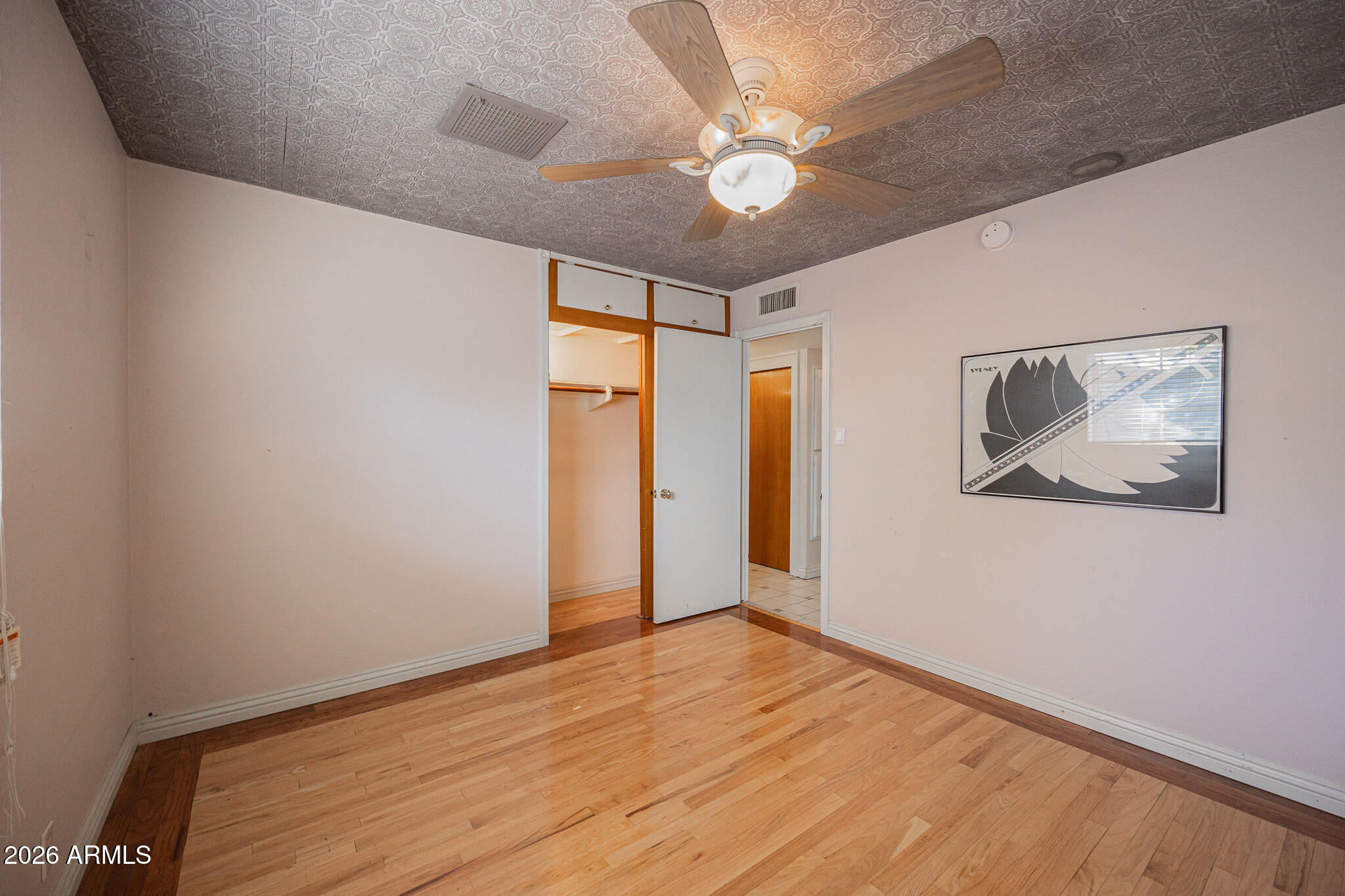 3137 North 4th Avenue Phoenix, AZ 85013 - Photo 24 of 36 a view of an empty room with wooden floor