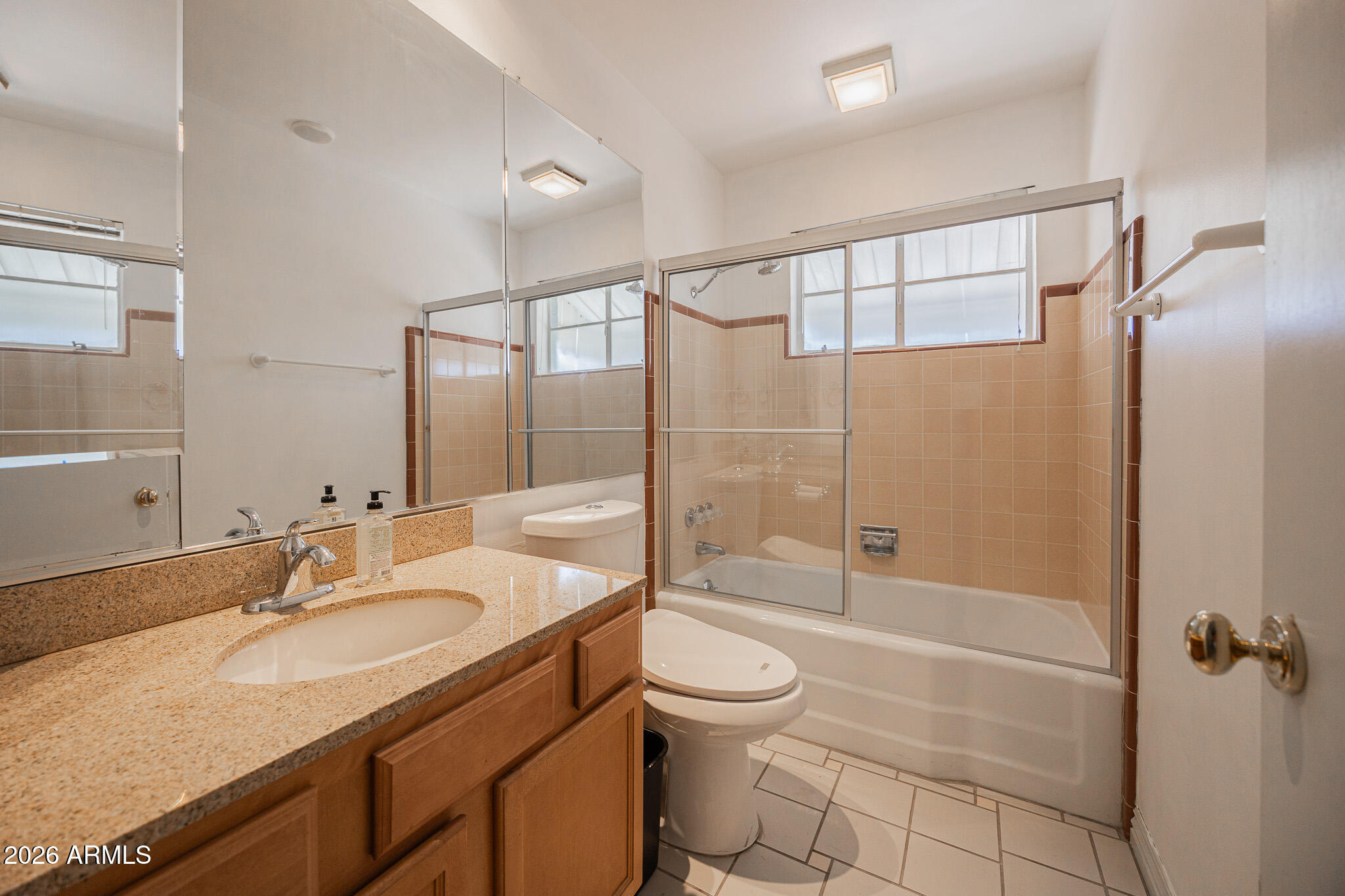 3137 North 4th Avenue Phoenix, AZ 85013 - Photo 25 of 36 a bathroom with a granite countertop sink toilet and shower