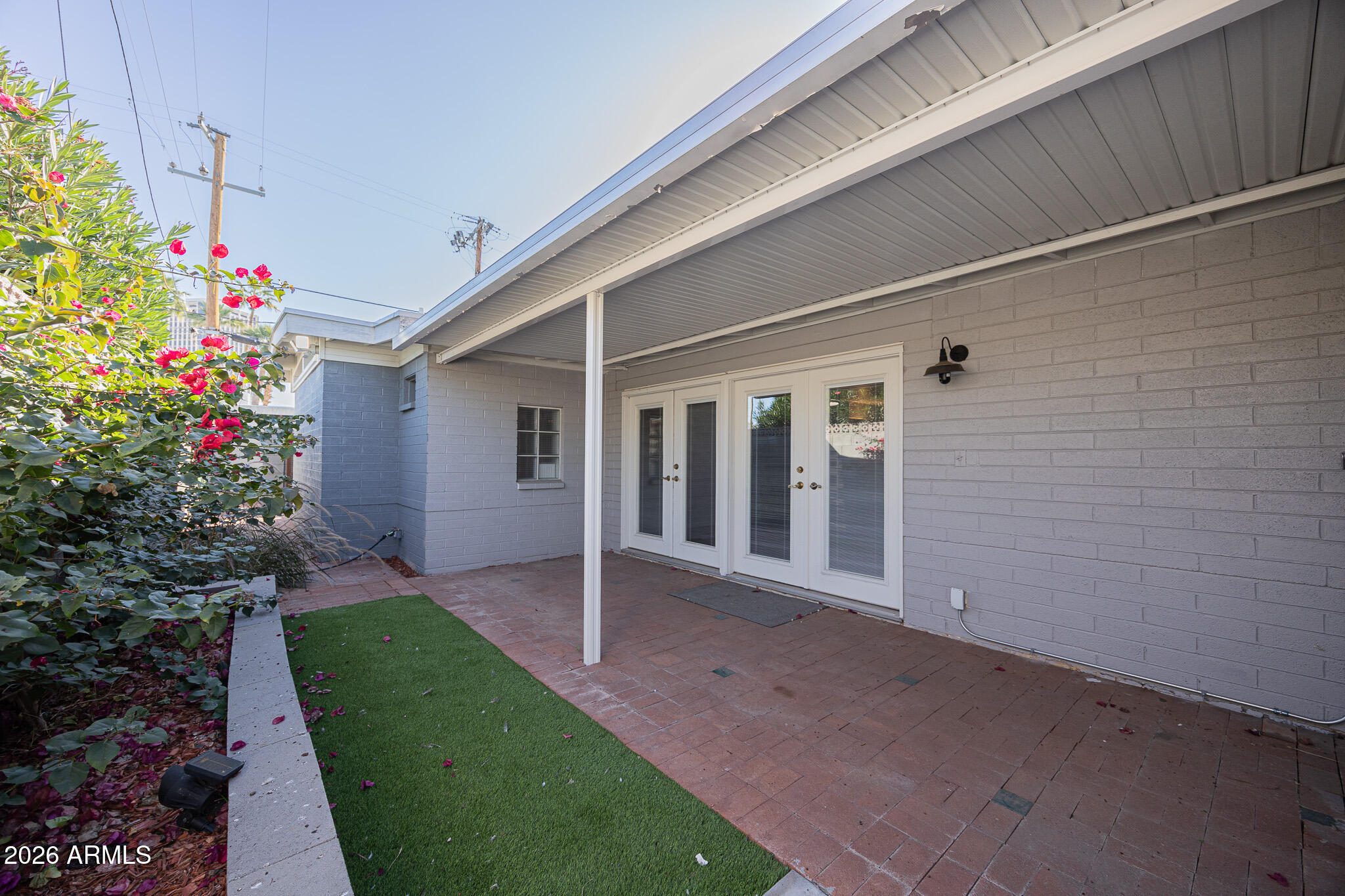 3137 North 4th Avenue Phoenix, AZ 85013 - Photo 30 of 36 a view of a house with a porch and garden