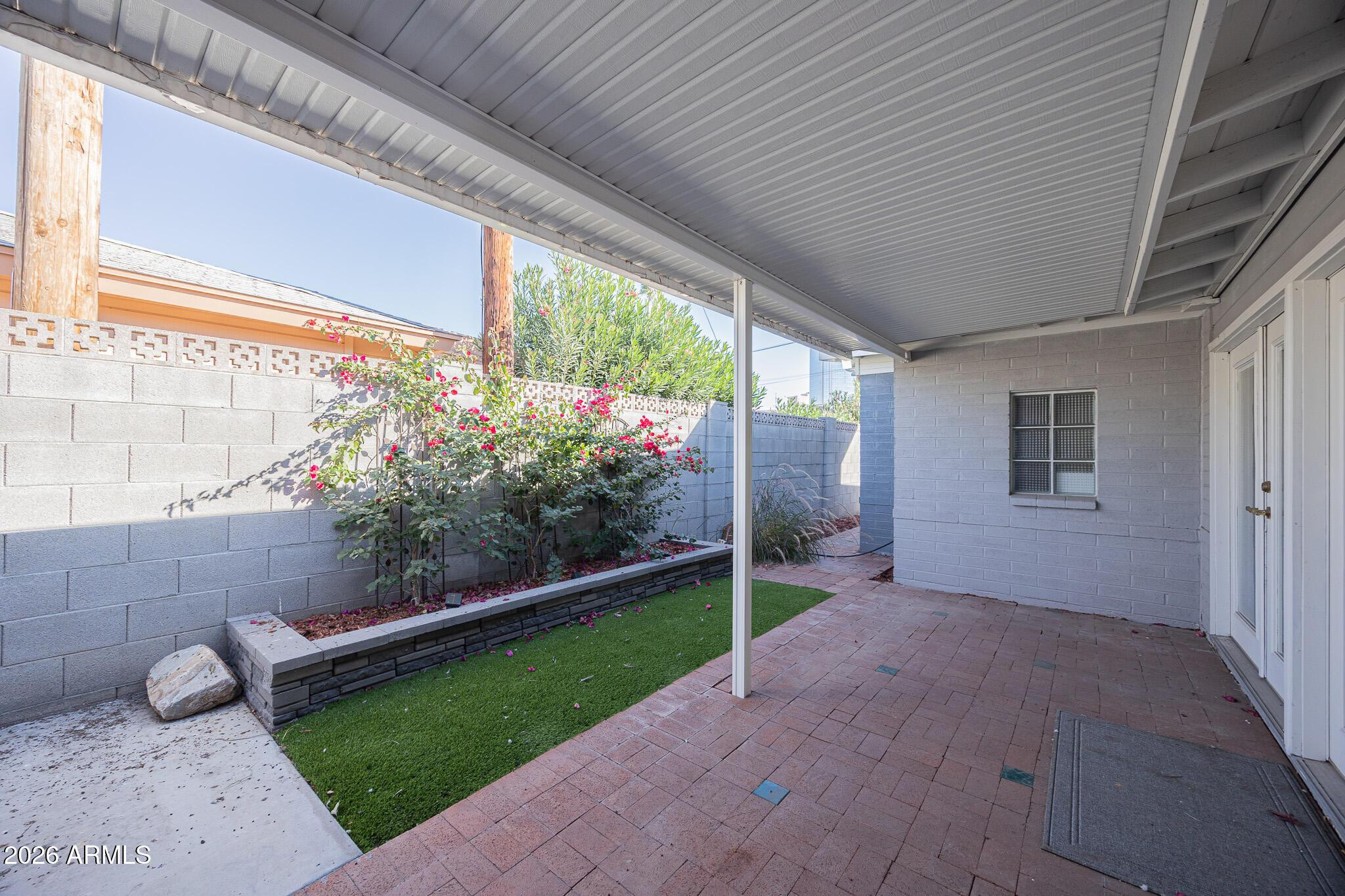 3137 North 4th Avenue Phoenix, AZ 85013 - Photo 32 of 36 a view of a porch with furniture and garden