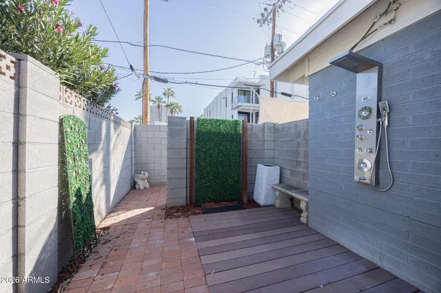 a view of a house with backyard and sitting area