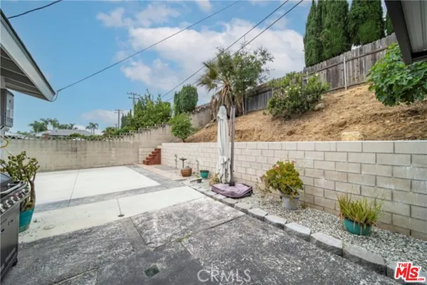 a kitchen with stainless steel appliances a stove sink microwave and cabinets