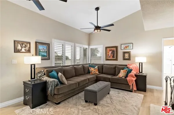 a living room with furniture and a window