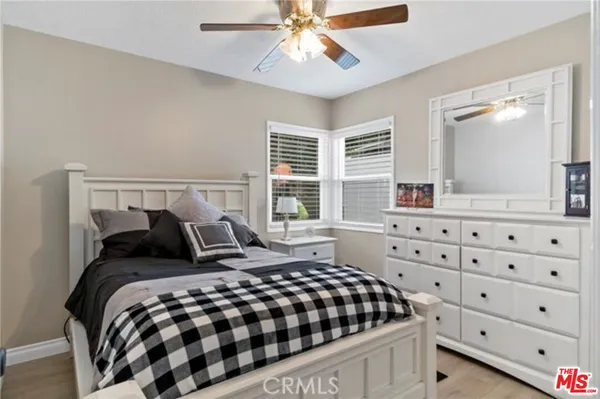 a bathroom with a sink mirror and a tub