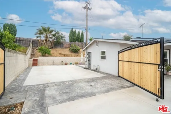 a white bath tub sitting in front of a house