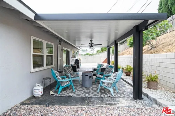 a view of a dining room with furniture wooden floor and a potted plant