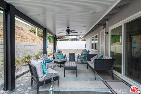 a outdoor living space with furniture and garden view