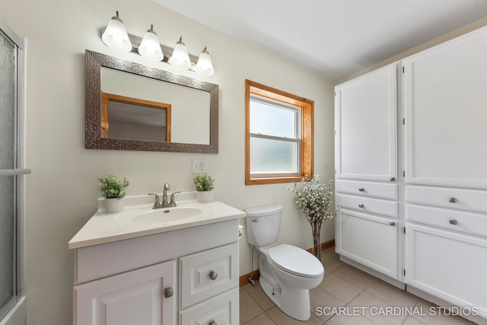 706 South Gables Boulevard Wheaton, IL 60189 - Photo 19 of 26 a bathroom with a toilet sink and mirror