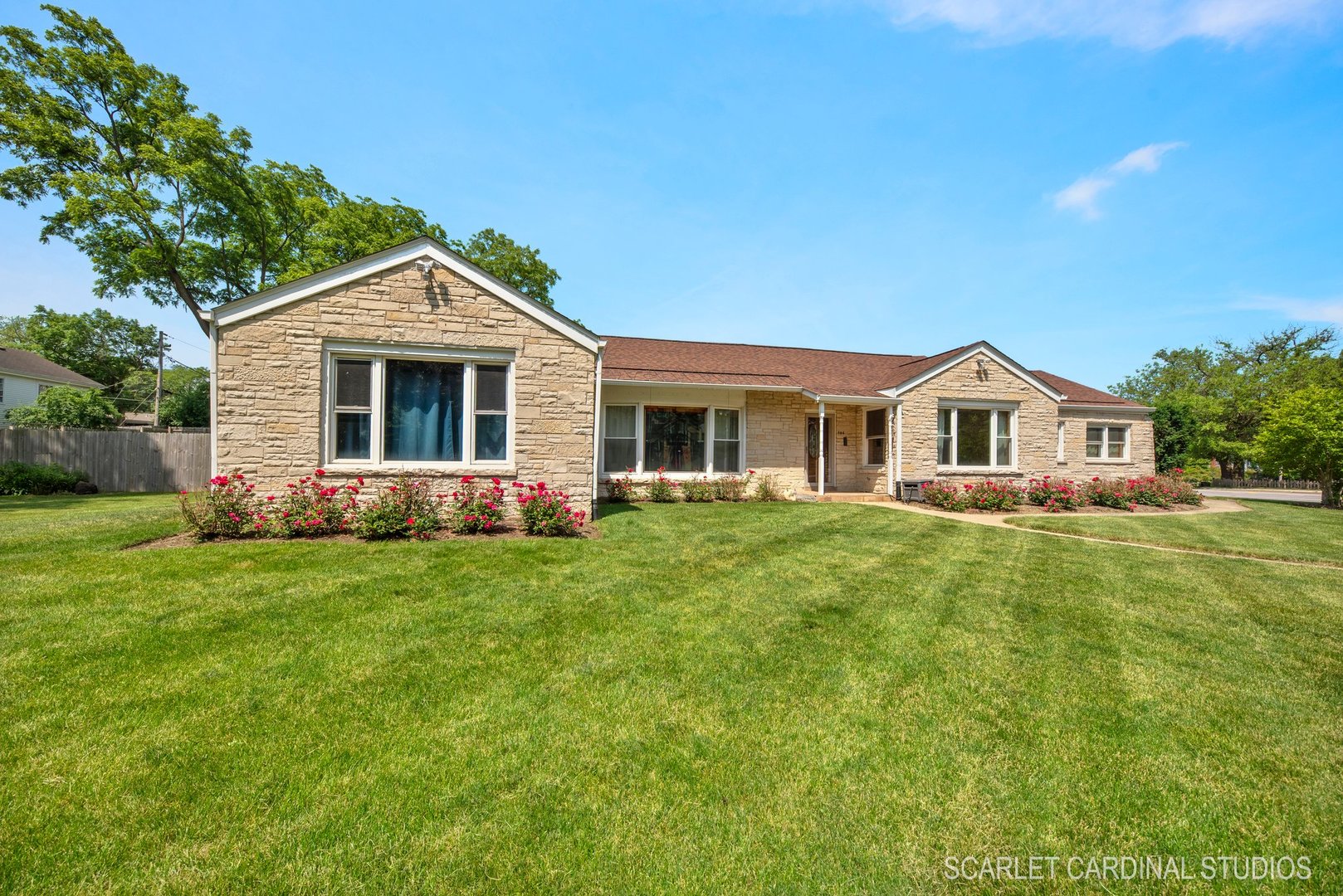706 South Gables Boulevard Wheaton, IL 60189 - Photo 2 of 26 a front view of a house with a yard