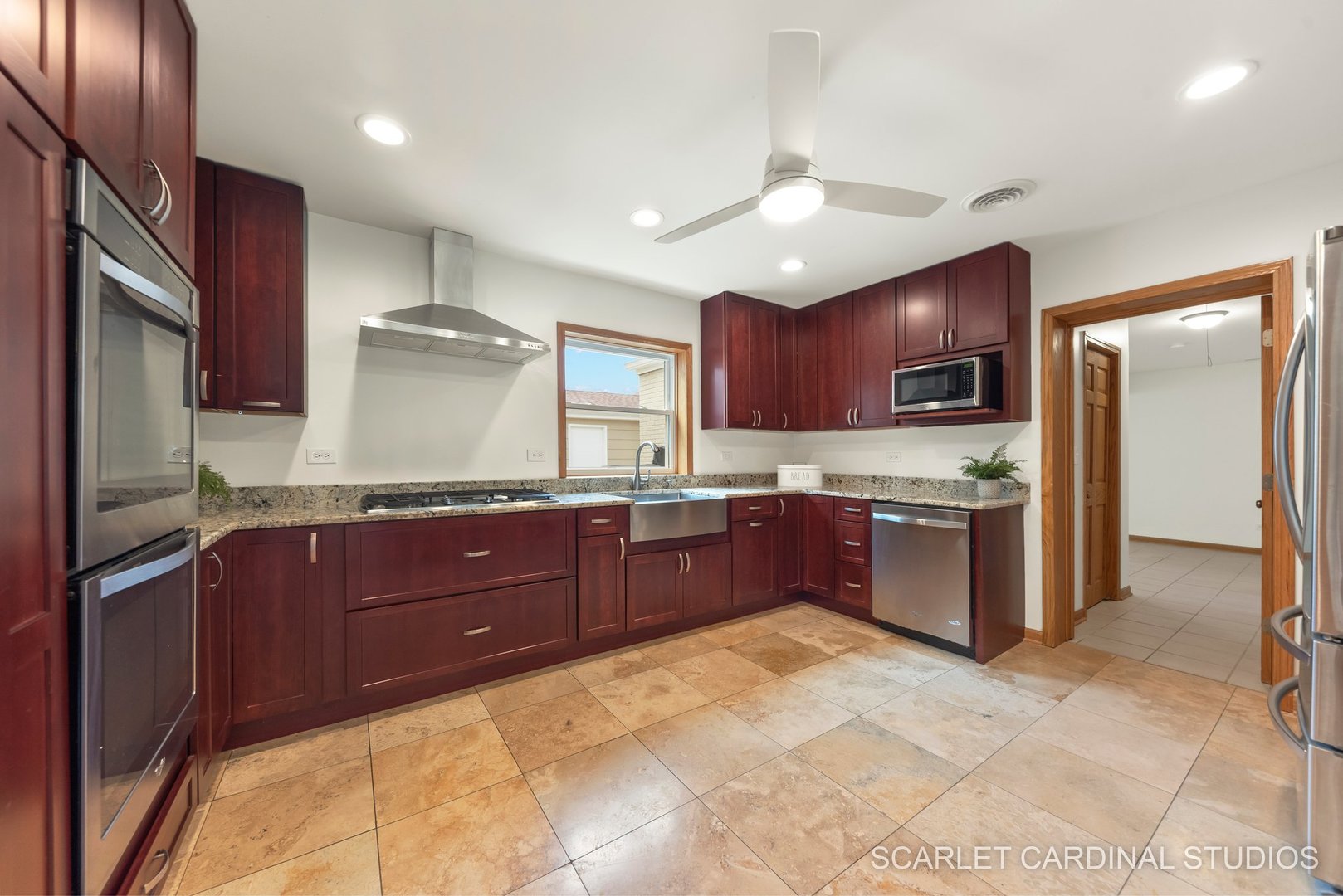706 South Gables Boulevard Wheaton, IL 60189 - Photo 6 of 26 a kitchen with stainless steel appliances granite countertop a refrigerator and stove
