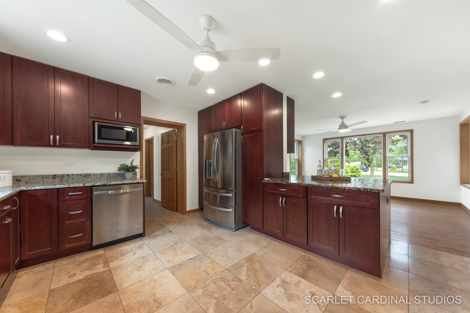 706 South Gables Boulevard Wheaton, IL 60189 - Photo 8 of 26 a kitchen with stainless steel appliances granite countertop wooden cabinets a granite counter tops and a stove