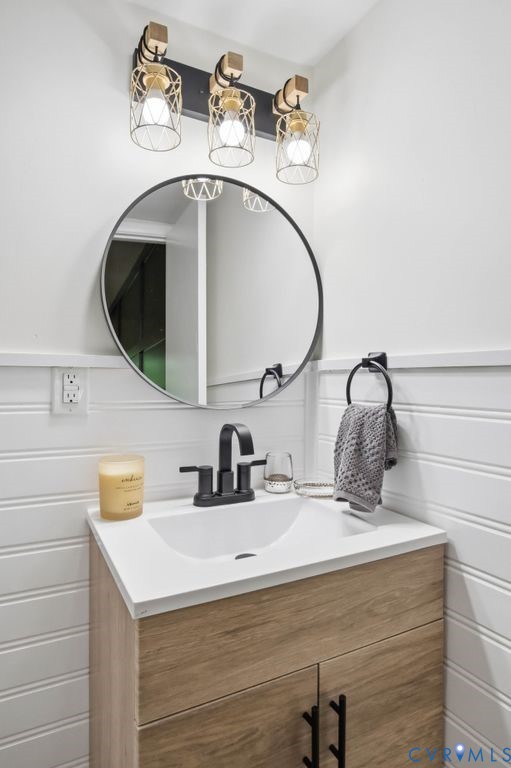 10270 Iron Mill Road Richmond, VA 23235 - Photo 23 of 29 Bathroom vanity featuring a white integrated sink,