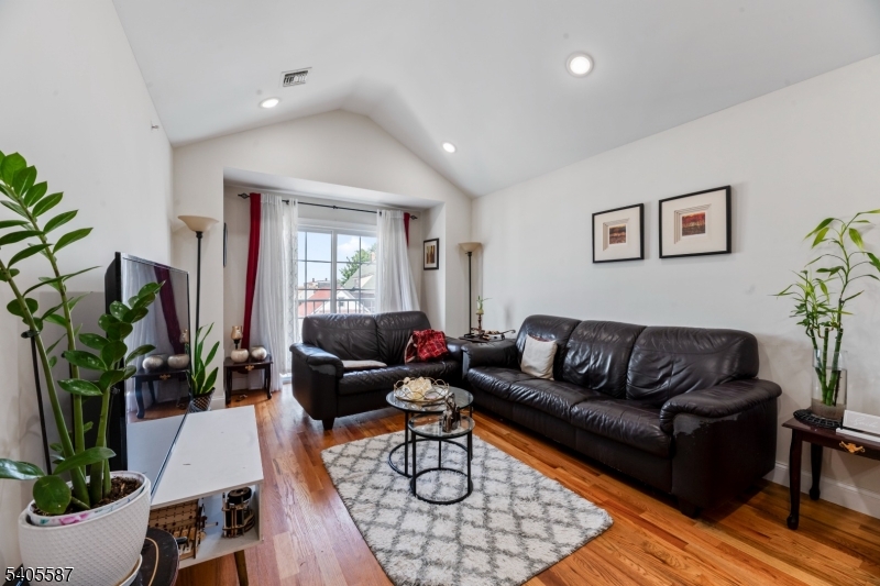 14 Spencer Street Elizabeth, NJ 07202 - Photo 16 of 39 a living room with furniture potted plant and a window