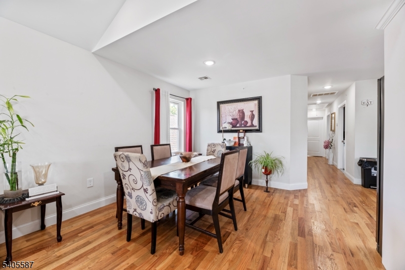 14 Spencer Street Elizabeth, NJ 07202 - Photo 18 of 39 a view of a dining room with furniture and wooden floor