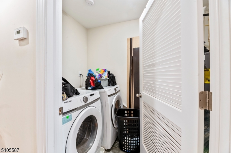 14 Spencer Street Elizabeth, NJ 07202 - Photo 29 of 39 a utility room with dryer and washer