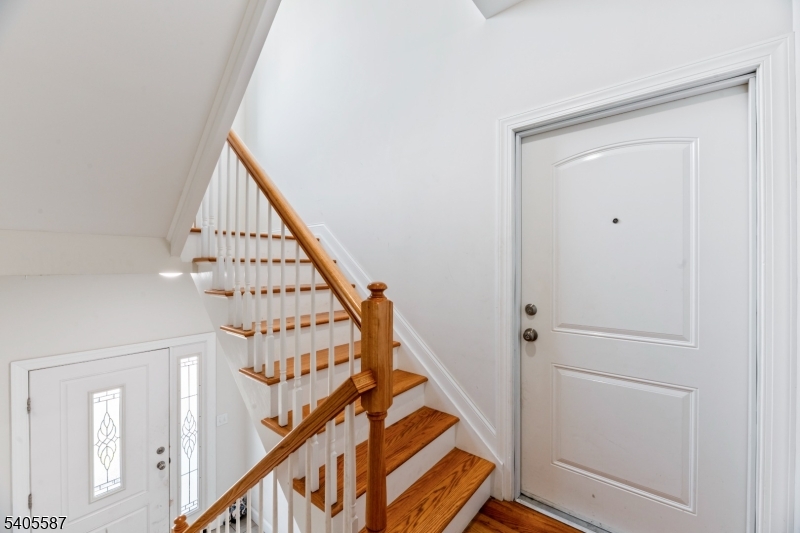 14 Spencer Street Elizabeth, NJ 07202 - Photo 4 of 39 a view of a staircase with wooden floor and stairs