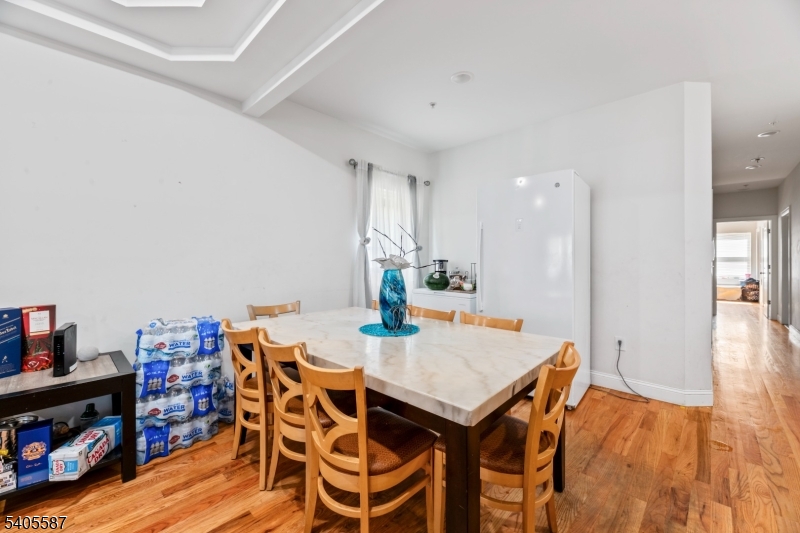 14 Spencer Street Elizabeth, NJ 07202 - Photo 7 of 39 a view of a dining room with furniture and wooden floor