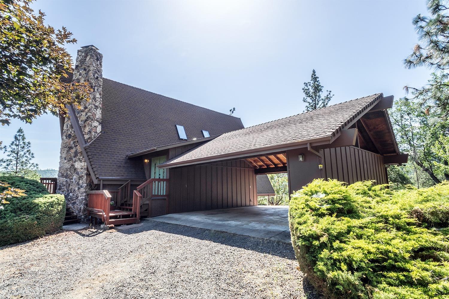 4000 East Antelope Road Eagle Point, OR 97524 - Photo 2 of 33 a front view of a house with a yard and seating space