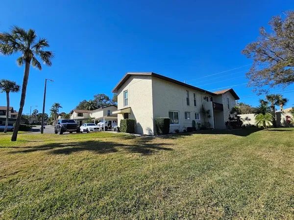 a view of a house with a yard