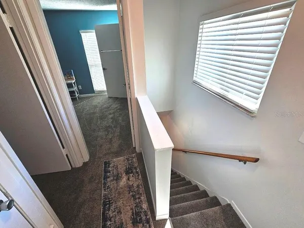 a view of stairs and an empty room