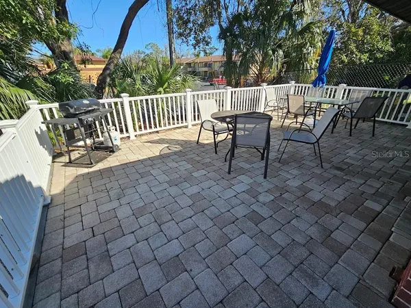 a view of a chairs and table in the patio