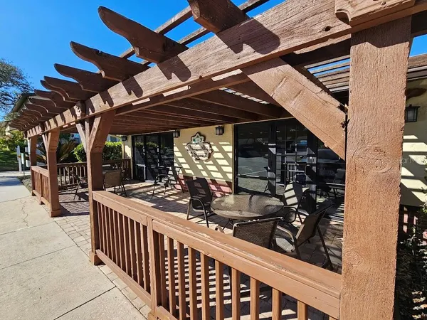 a view of a chairs and tables in the patio