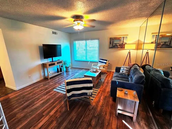 a room with furniture and a flat screen tv