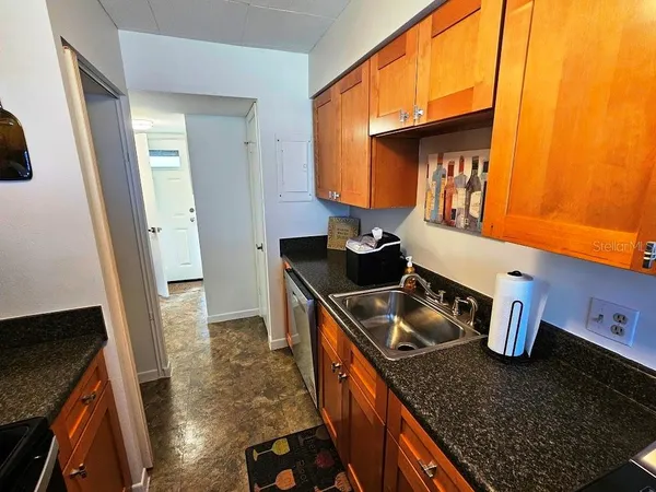 a kitchen with a stove and a sink