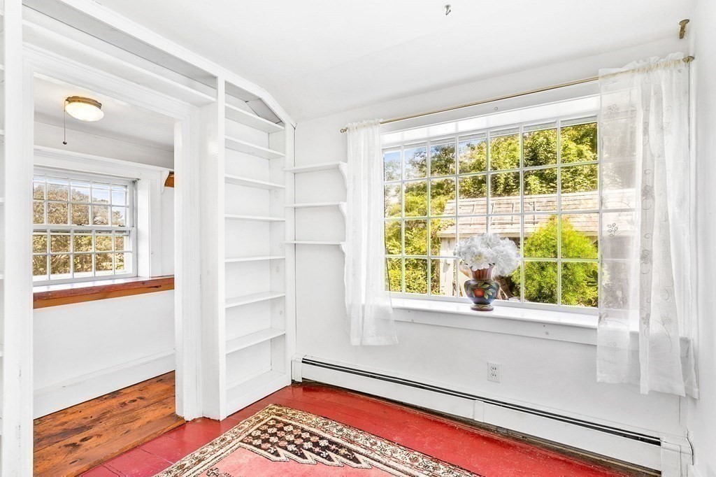 1050 County Road Bourne, MA 02534 - Photo 17 of 42 a bedroom with a bed and a window