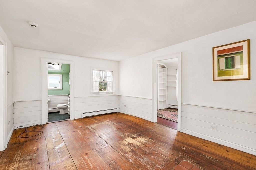 1050 County Road Bourne, MA 02534 - Photo 18 of 42 a view of empty room with wooden floor and window