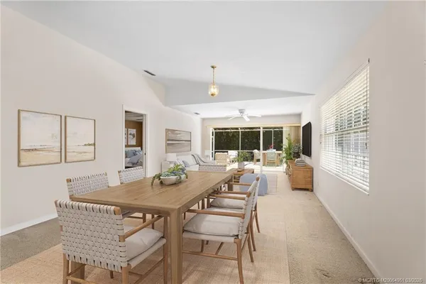 a view of a dining room with furniture window and outside view