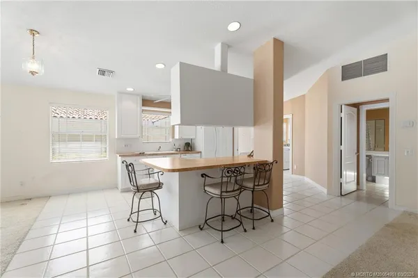 a kitchen with a sink cabinets and window