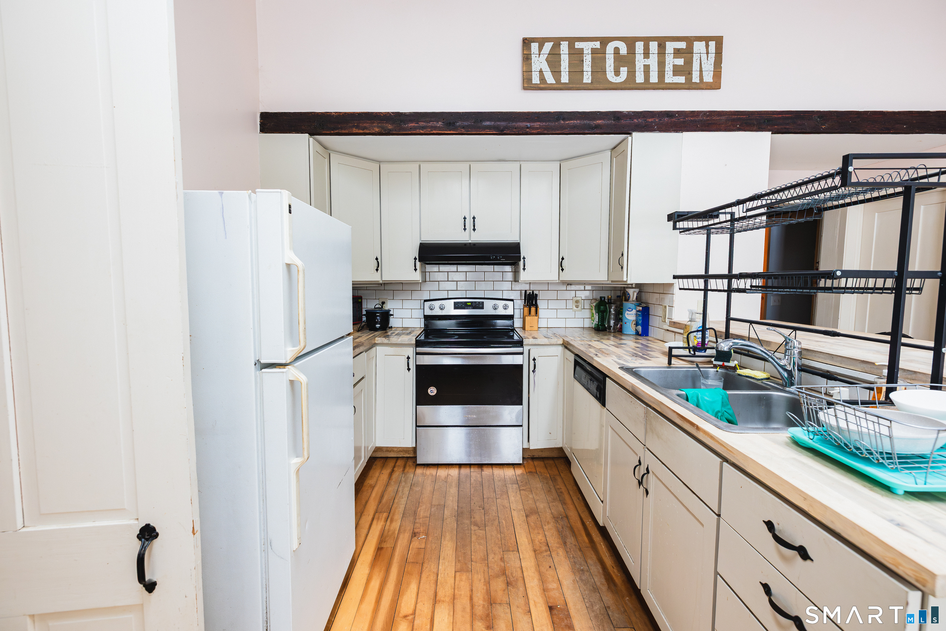 934 Storrs Road Mansfield, CT 06268 - Photo 16 of 20 a kitchen with stainless steel appliances a refrigerator and a stove