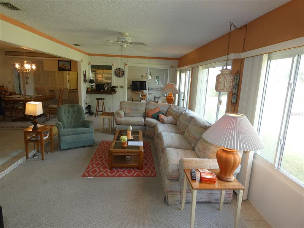 11151 Sandtrap Drive, Unit 11151 Port Richey, FL 34668 - Photo 13 of 33 a living room with furniture