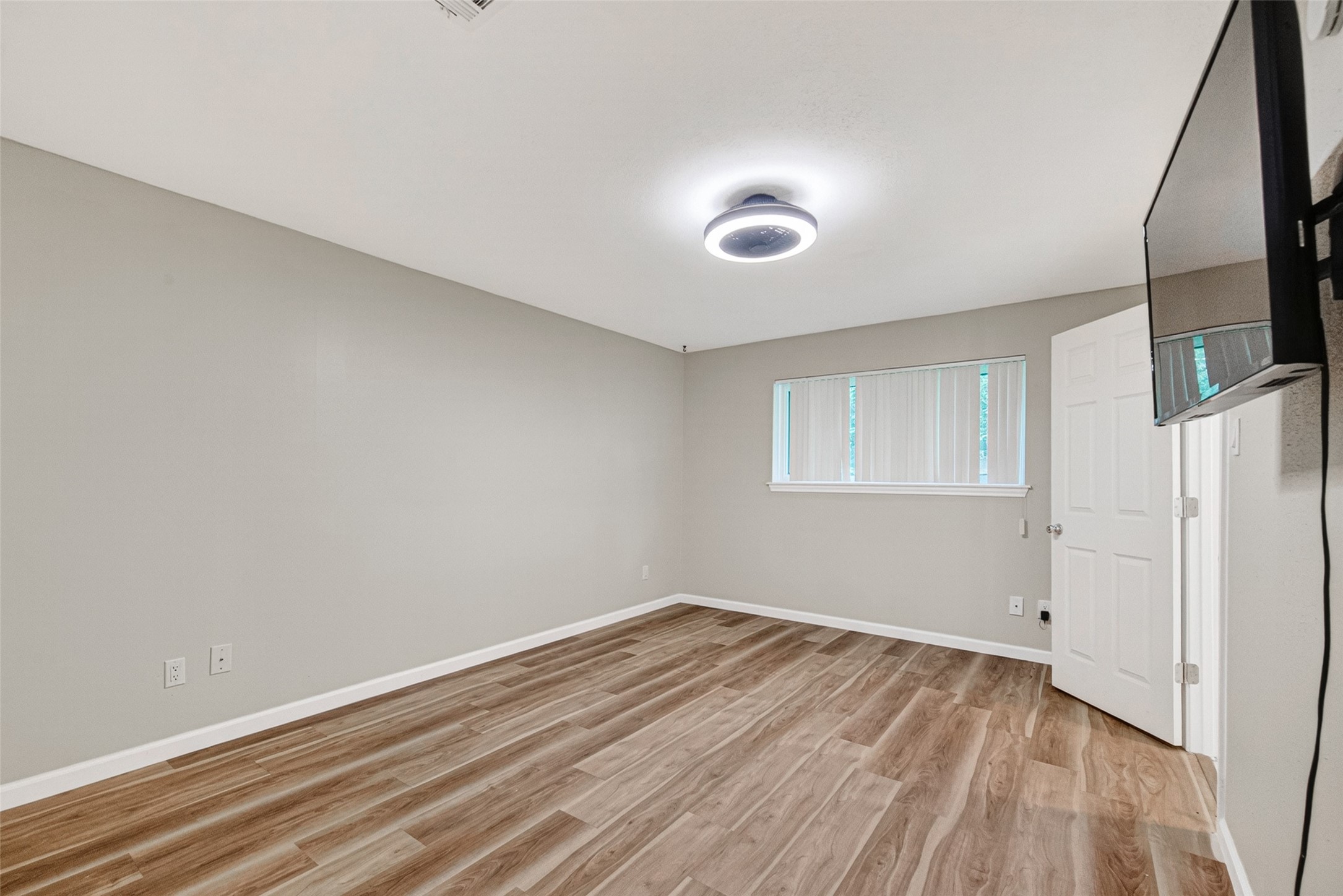 25503 Foxbriar Lane Spring, TX 77373 - Photo 32 of 45 a view of room with wooden floor and fan
