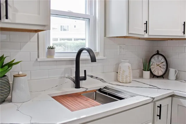 a kitchen with a sink and a stove