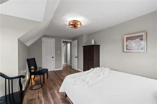 a bedroom with a bed and a table