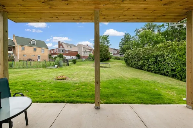 a view of a garden with a building in the background